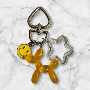 Yellow Balloon Dog Keychain with Smiley and Star Charms